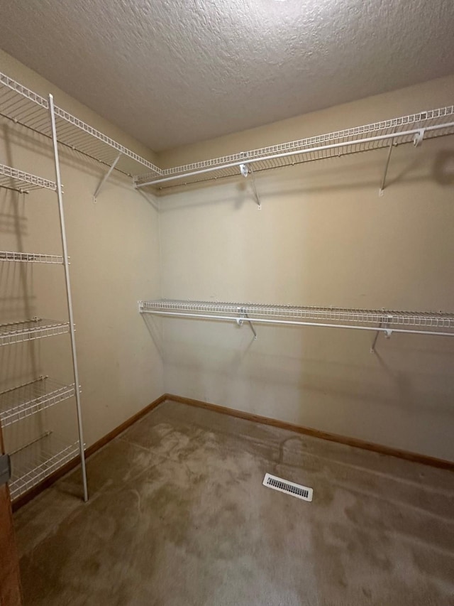 322 N 15th Ave, Winterset, IA 50273 - walk in closet featuring carpet