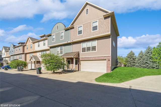 view of property featuring a residential view, driveway, an attached garage, brick siding, and a front lawn