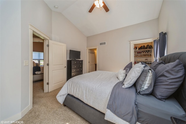 carpeted bedroom with high vaulted ceiling and ceiling fan