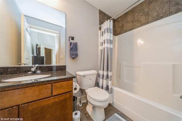 bathroom featuring toilet, vanity, shower / bath combo, baseboards, and tile patterned flooring