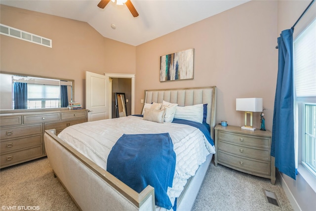 bedroom with light carpet, lofted ceiling, and ceiling fan