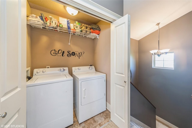 clothes washing area with washing machine and clothes dryer