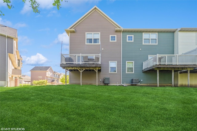 back of property featuring cooling unit, a lawn, and a deck