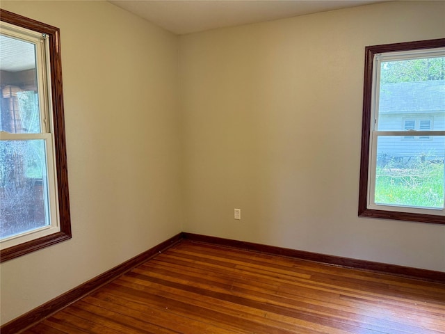 2036 Capitol Ave, Des Moines, IA 50317 - unfurnished room featuring dark wood-style flooring and baseboards