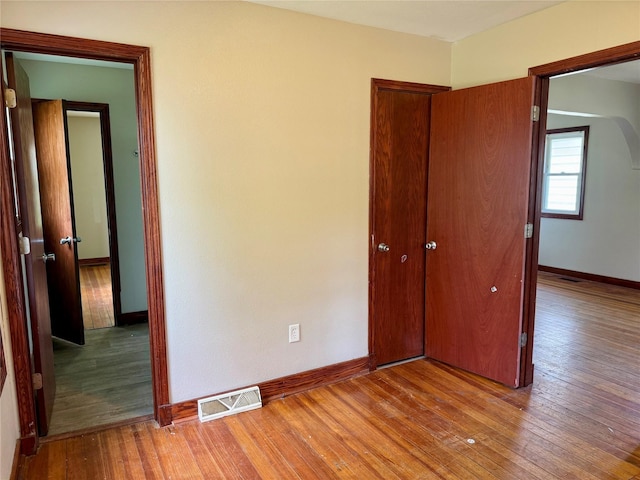 2036 Capitol Ave, Des Moines, IA 50317 - unfurnished bedroom with baseboards and light wood finished floors