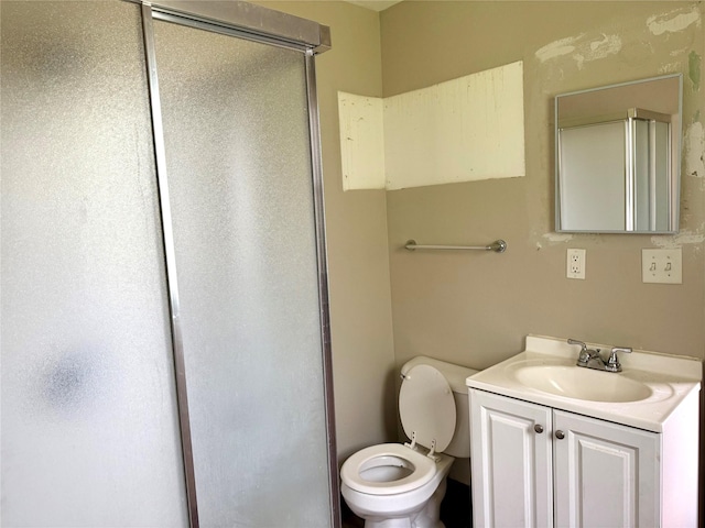 2036 Capitol Ave, Des Moines, IA 50317 - bathroom with a stall shower, vanity, and toilet
