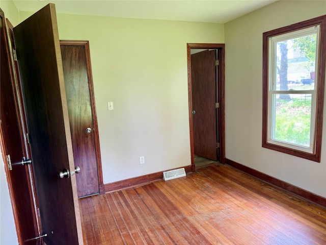 2036 Capitol Ave, Des Moines, IA 50317 - unfurnished room with baseboards and light wood-type flooring