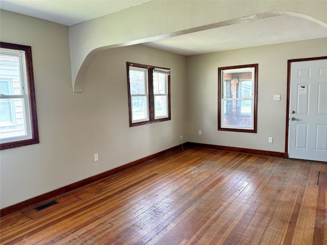 2036 Capitol Ave, Des Moines, IA 50317 - foyer entrance featuring wood-type flooring, arched walkways, and baseboards