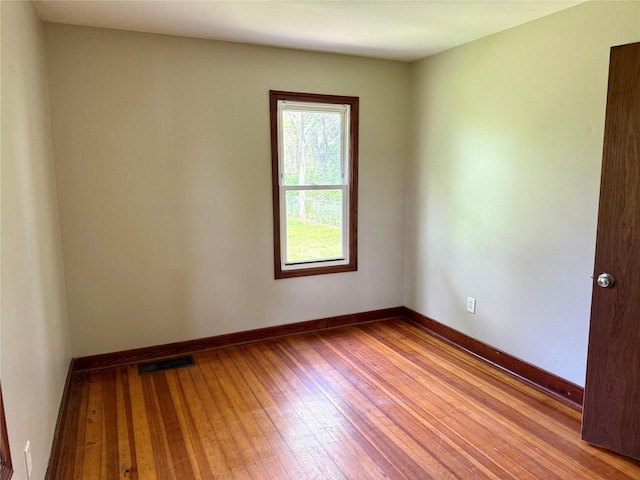2036 Capitol Ave, Des Moines, IA 50317 - spare room with wood-type flooring and baseboards