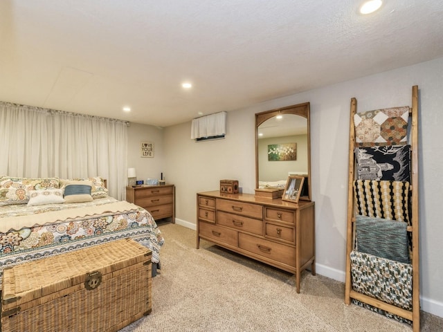 bedroom featuring light carpet, recessed lighting, and baseboards