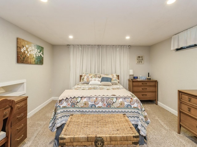 bedroom featuring light colored carpet, recessed lighting, and baseboards