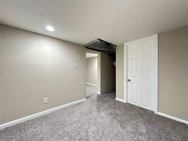 3429 54th St, Des Moines, IA 50310 - finished basement featuring carpet floors, baseboards, a textured ceiling, and a textured wall