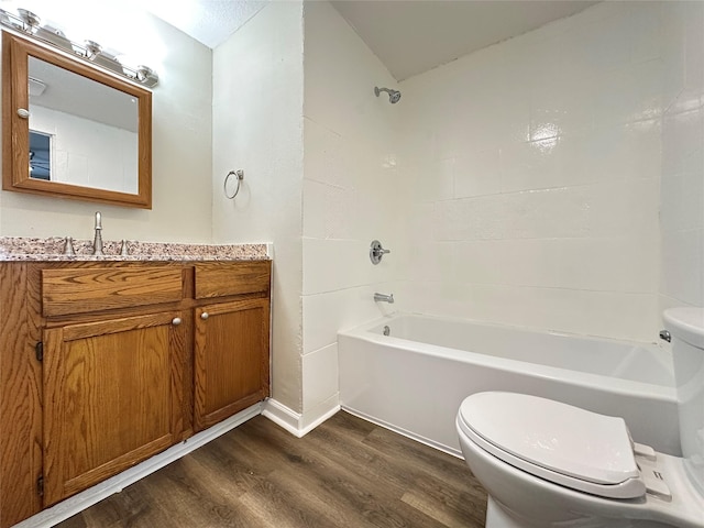 3429 54th St, Des Moines, IA 50310 - bathroom featuring toilet, wood finished floors, shower / washtub combination, and vanity