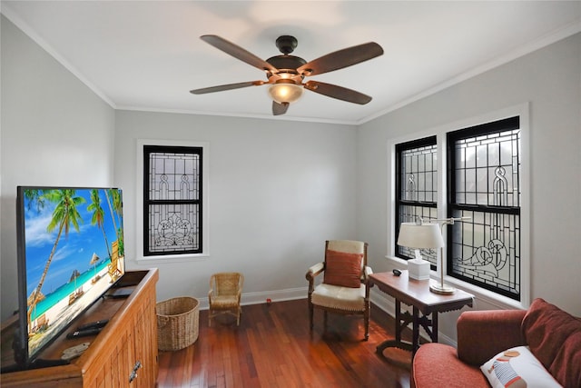 office space with ornamental molding, wood-type flooring, baseboards, and ceiling fan