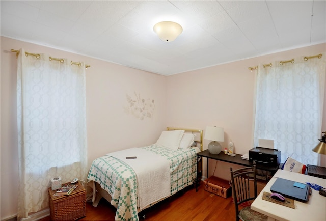 bedroom featuring wood finished floors