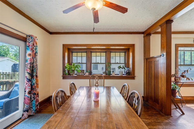 2007 E 12th St, Des Moines, IA 50316 - dining room featuring wood finished floors, ceiling fan, and crown molding