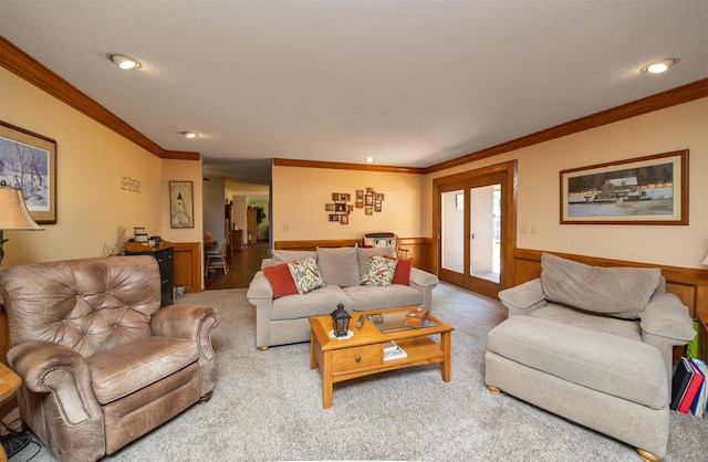 10760 Elmcrest Dr, Clive, IA 50325 - carpeted living room with crown molding, a wainscoted wall, and recessed lighting
