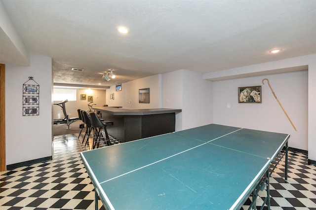 10760 Elmcrest Dr, Clive, IA 50325 - rec room with tile patterned floors, a community bar, baseboards, recessed lighting, and track lighting