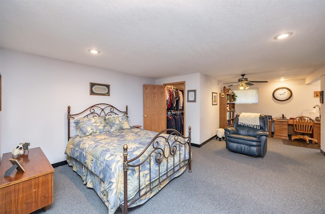10760 Elmcrest Dr, Clive, IA 50325 - bedroom featuring carpet flooring, a spacious closet, recessed lighting, baseboards, and a closet