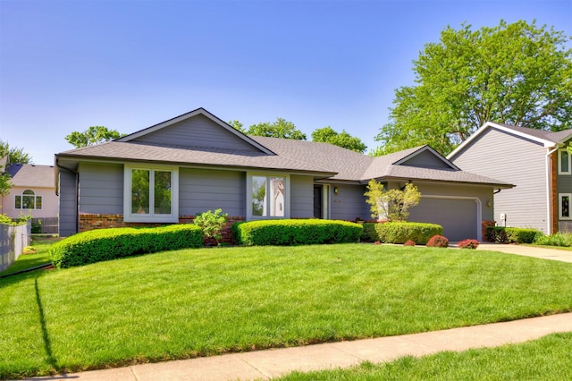 10760 Elmcrest Dr, Clive, IA 50325 - ranch-style house with an attached garage, a front yard, concrete driveway, and a shingled roof