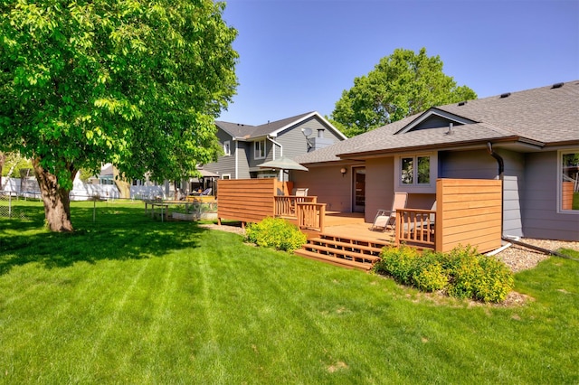 10760 Elmcrest Dr, Clive, IA 50325 - rear view of property with a shingled roof and a wooden deck