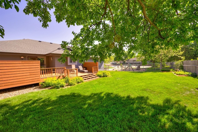 10760 Elmcrest Dr, Clive, IA 50325 - view of yard featuring a wooden deck