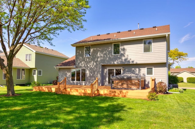 5433 NW 89th St, Johnston, IA 50131 - rear view of house featuring a wooden deck and a lawn