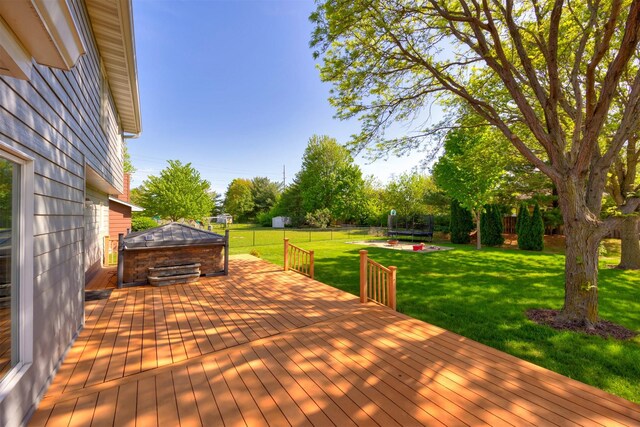 5433 NW 89th St, Johnston, IA 50131 - wooden terrace with a trampoline