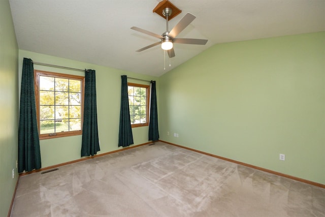 5433 NW 89th St, Johnston, IA 50131 - spare room with vaulted ceiling, a ceiling fan, healthy amount of natural light, baseboards, and light carpet