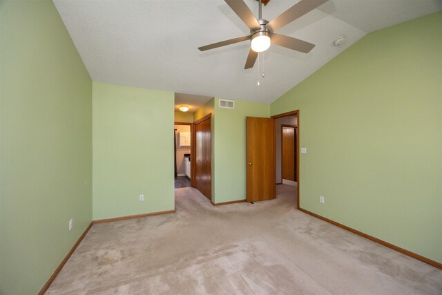 5433 NW 89th St, Johnston, IA 50131 - carpeted spare room featuring lofted ceiling, ceiling fan, baseboards, and a smoke detector