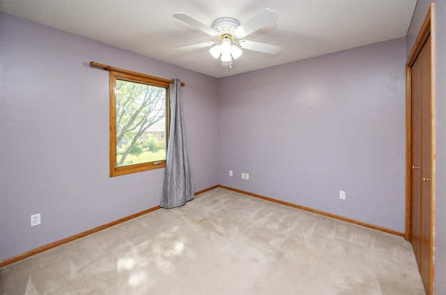 5433 NW 89th St, Johnston, IA 50131 - spare room featuring ceiling fan, baseboards, and light carpet