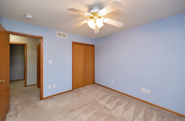 5433 NW 89th St, Johnston, IA 50131 - unfurnished bedroom with light colored carpet, baseboards, a closet, and ceiling fan