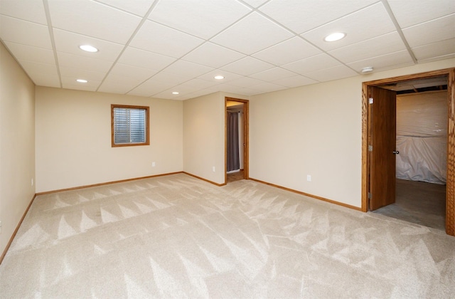 5433 NW 89th St, Johnston, IA 50131 - empty room with baseboards, light colored carpet, recessed lighting, and a paneled ceiling