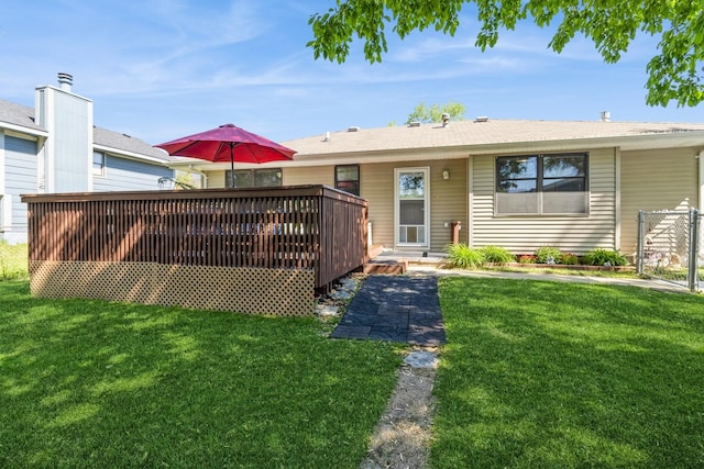 604 NE 8th St, Grimes, IA 50111 - back of house with a wooden deck and a lawn