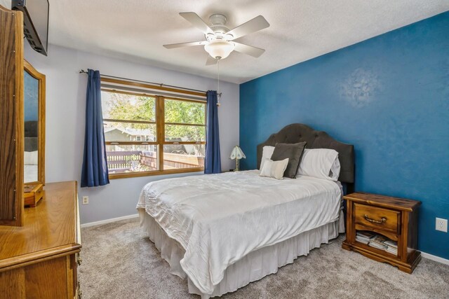 604 NE 8th St, Grimes, IA 50111 - bedroom with carpet floors, baseboards, and ceiling fan