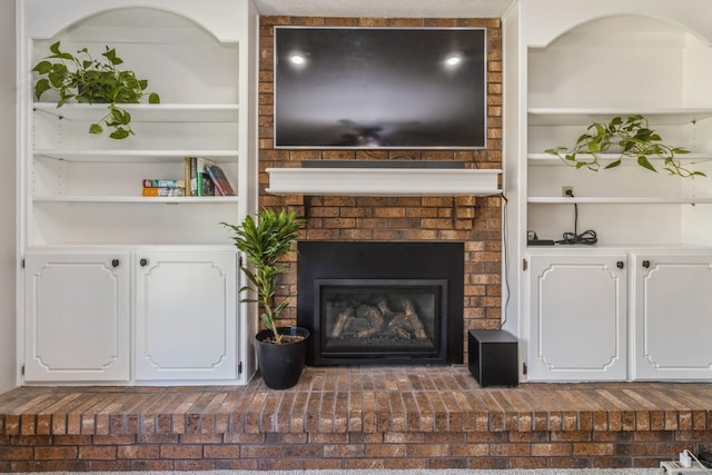 604 NE 8th St, Grimes, IA 50111 - living area featuring built in shelves and a fireplace