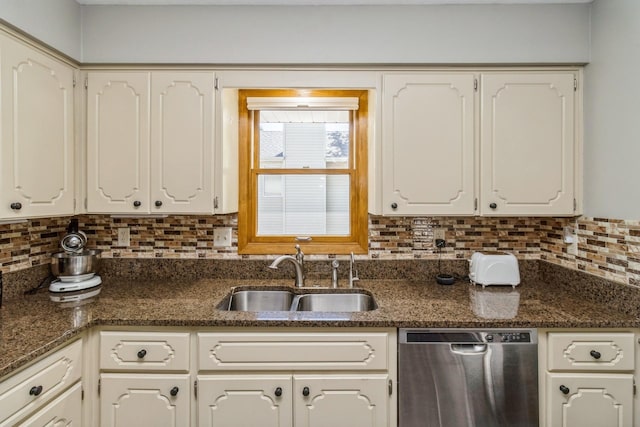 604 NE 8th St, Grimes, IA 50111 - kitchen with stainless steel dishwasher, a sink, tasteful backsplash, and white cabinetry