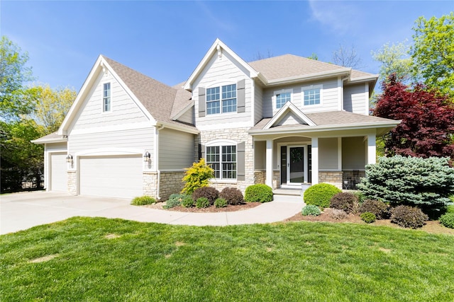craftsman-style home with stone siding, a front lawn, roof with shingles, and concrete driveway