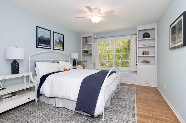 bedroom featuring light wood finished floors and a ceiling fan