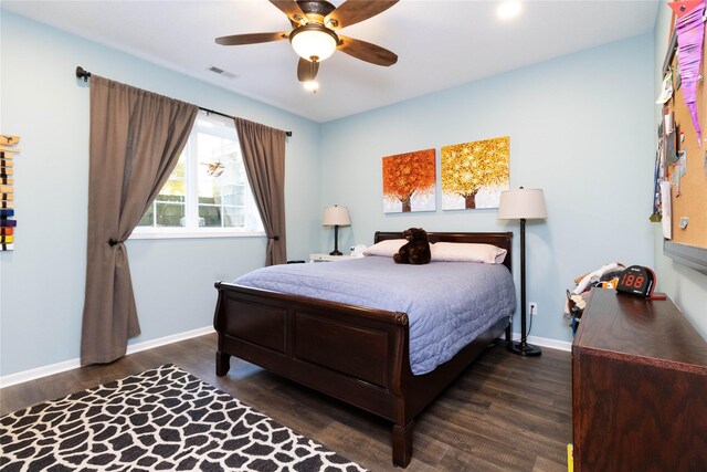bedroom featuring wood finished floors, baseboards, and a ceiling fan