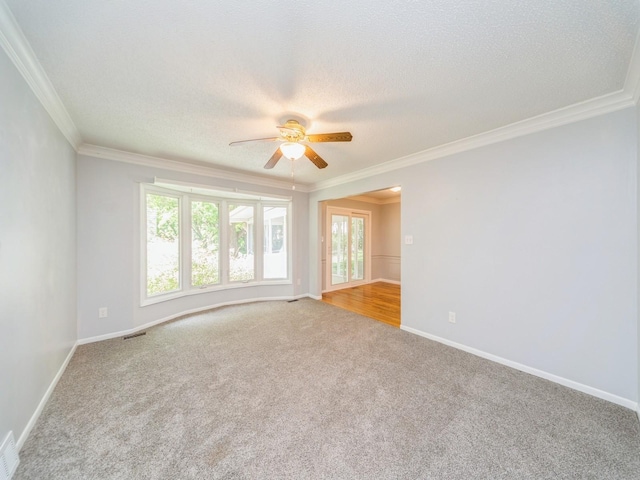 3800 Western Hills Dr, West Des Moines, IA 50265 - spare room featuring ceiling fan, carpet, ornamental molding, a textured ceiling, and baseboards