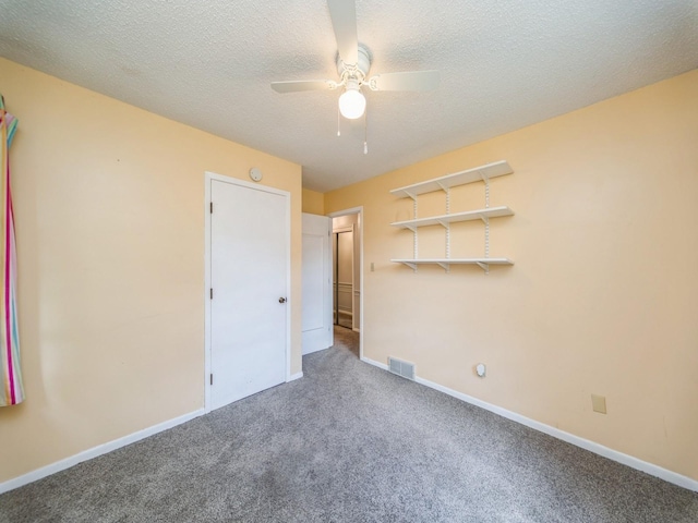 3800 Western Hills Dr, West Des Moines, IA 50265 - unfurnished bedroom with carpet floors, baseboards, ceiling fan, and a textured ceiling