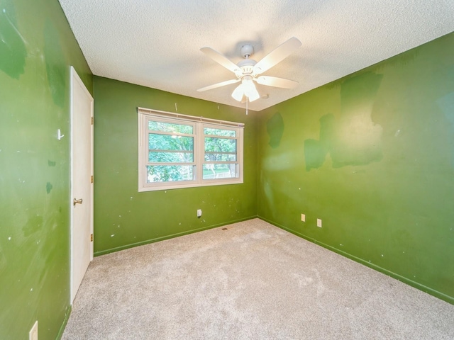 3800 Western Hills Dr, West Des Moines, IA 50265 - carpeted empty room with a textured ceiling, baseboards, and ceiling fan