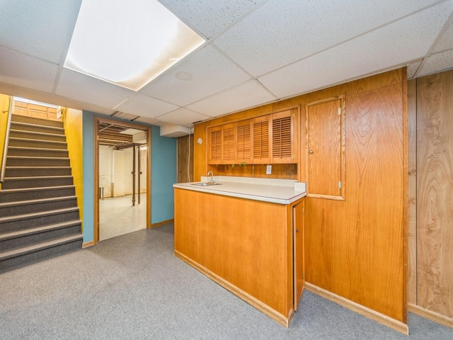 3800 Western Hills Dr, West Des Moines, IA 50265 - indoor wet bar with a paneled ceiling, stairs, carpet, and baseboards