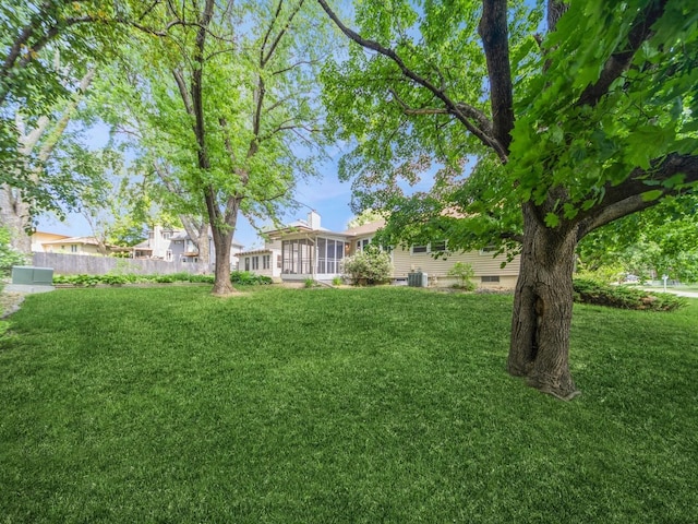 3800 Western Hills Dr, West Des Moines, IA 50265 - view of yard featuring a sunroom and central AC unit