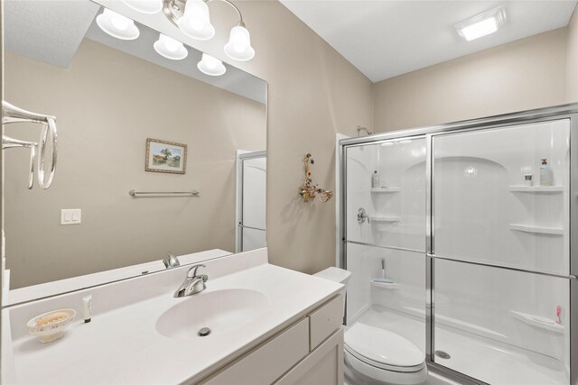 4400 132nd St, Urbandale, IA 50323 - full bathroom with a shower stall, toilet, and vanity
