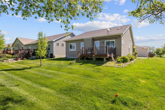 4400 132nd St, Urbandale, IA 50323 - back of property with a deck and a yard