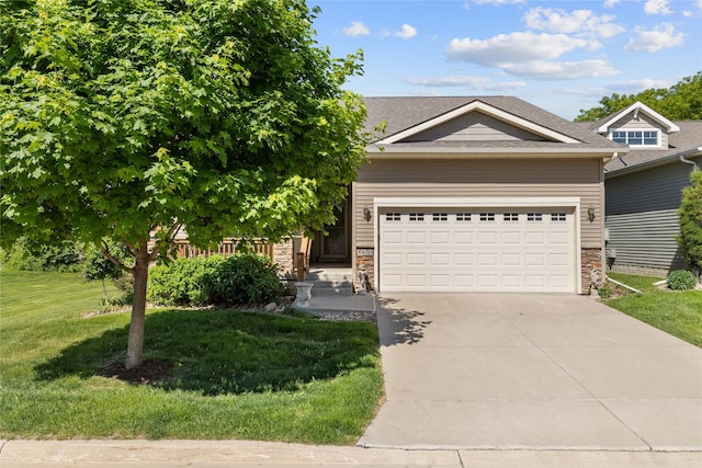 4400 132nd St, Urbandale, IA 50323 - view of front of home with a front yard, driveway, stone siding, and an attached garage