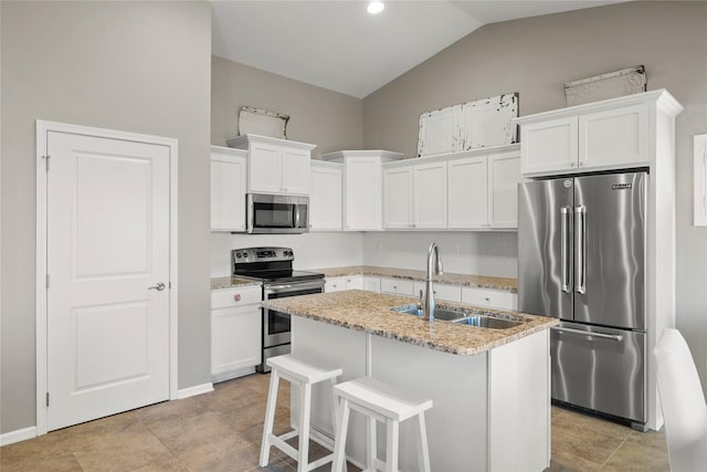 4400 132nd St, Urbandale, IA 50323 - kitchen featuring appliances with stainless steel finishes, a sink, lofted ceiling, light stone counters, and white cabinetry