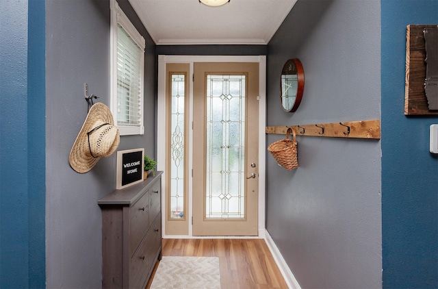 1807 11th St, Des Moines, IA 50314 - entryway with light wood-style floors, baseboards, and crown molding